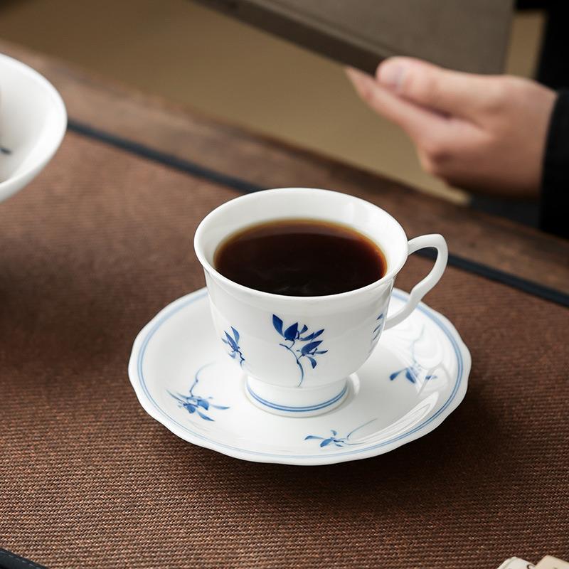 猪油白釉下手绘咖啡杯蝴蝶兰陶瓷中国白单杯带碟子手柄高档个人杯