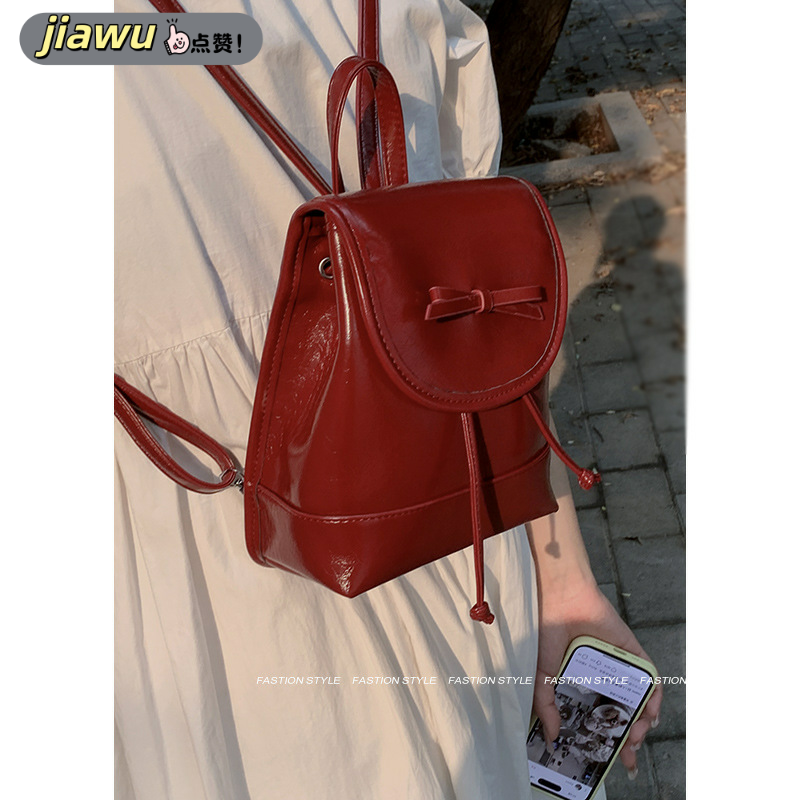 新款 时尚蝴蝶结双肩包包女式包韩版背包学院风手提红色水桶包双