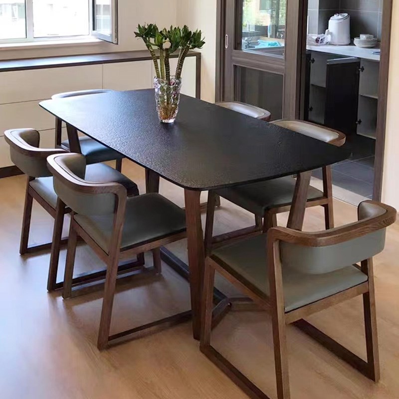 火烧石餐桌椅组合现代简约家用小户型长方形实木纯黑色火山石饭桌