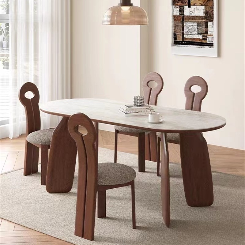 法式复古洞石岩板餐桌椅组合简约小户型家用实木椭圆形设计师餐桌