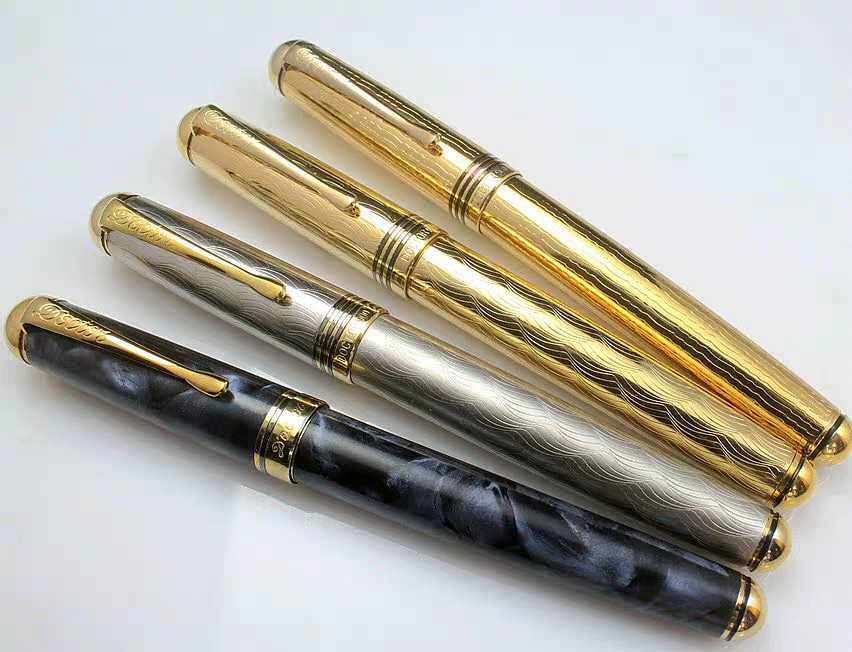 英雄900钢笔 博士900钢笔大明尖金色刻花大笔杆铱金笔带水钻重49g