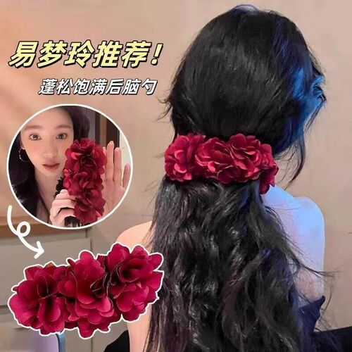 The bloggers matching flower-back-of-the-head style, featur