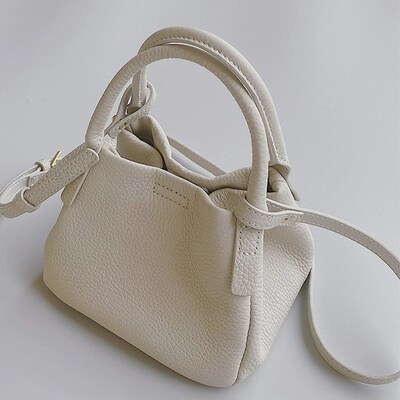 高级质感白色水桶手提小包包女2024新款小众菜篮子单肩斜跨包春季