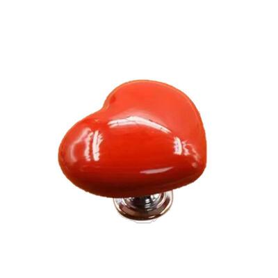 Heart-shaped toilet flush button accessory, designed for use