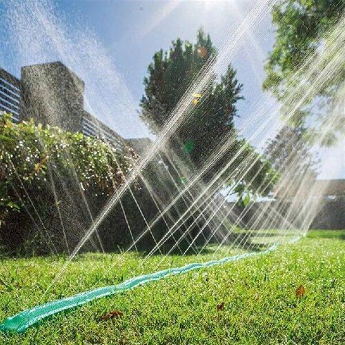 1 Set of Sprinkler Heads and Soaking Hoses. The Ground