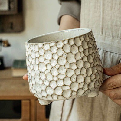 Pinecone-shaped three-legged ceramic storage jar and kitchen