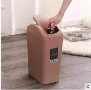 Black dustbin with cover and cover toilet paper to put in