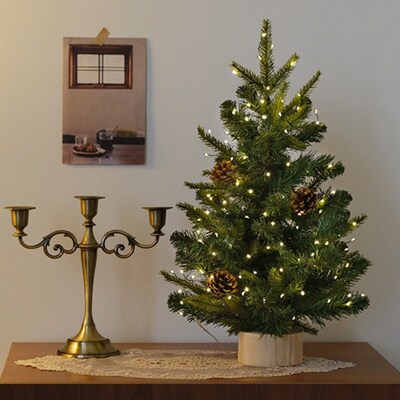 Snow-covered Christmas tree, desktop Christmas decoration