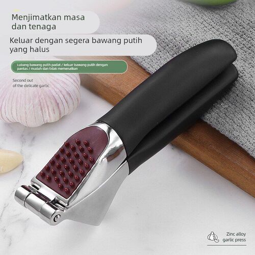 Zinc alloy manual garlic press, thickened for household use.