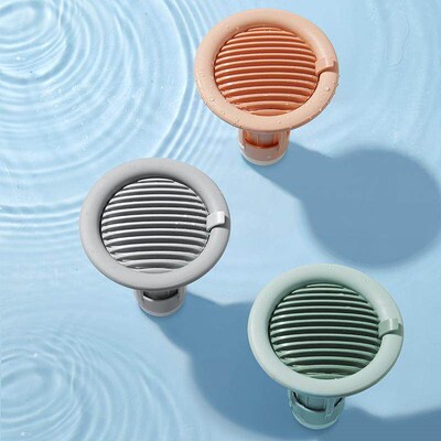 Wave-patterned anti-odor drain core for bathroom floor drain