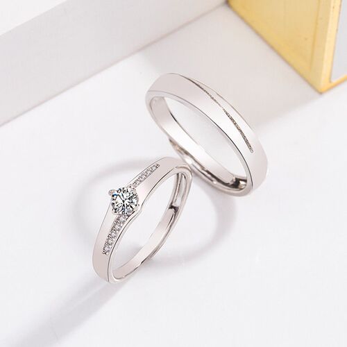 Diamond-encrusted zircon couple rings a pair of opening adju