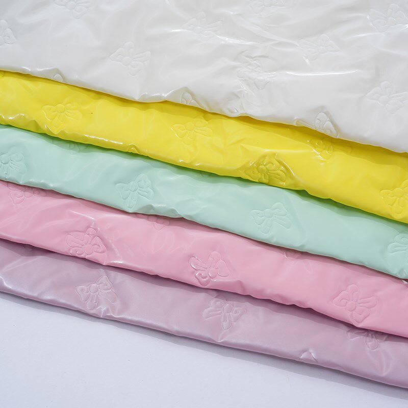 新品蝴蝶结绗缝PU皮革面料服装笔记本箱包手袋防水布超声波夹棉DI