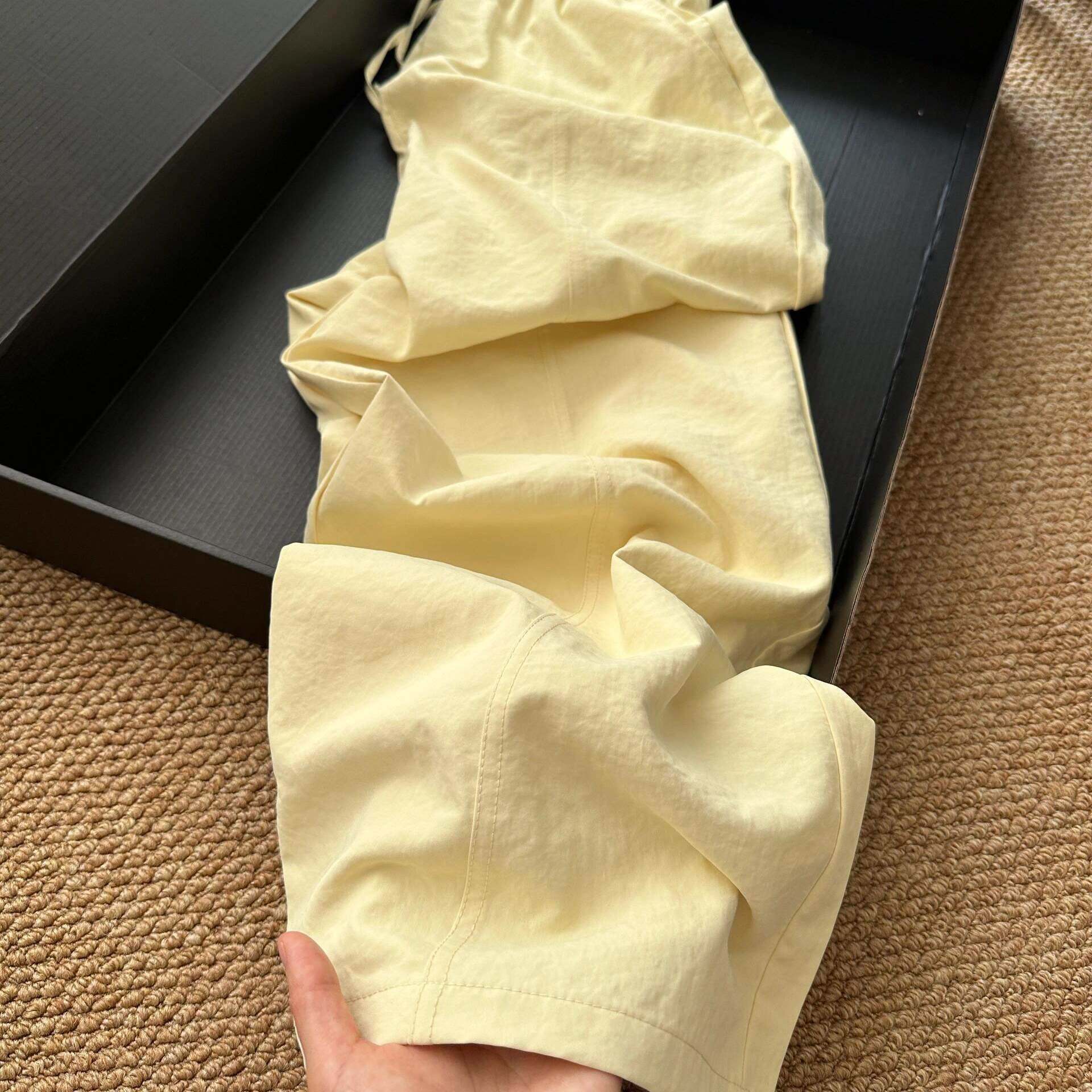 慵懒风奶黄色速干休闲裤女2025夏季新款宽松垂感松紧腰阔腿长裤子