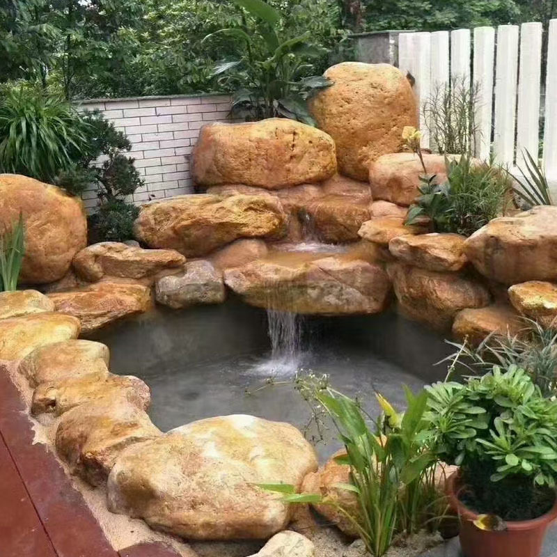 黄蜡石大型鹅卵石鱼池驳岸造景