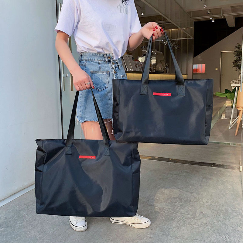 装衣服的手提袋子帆布收纳袋大容量整理学生男女行李包可套拉杆箱