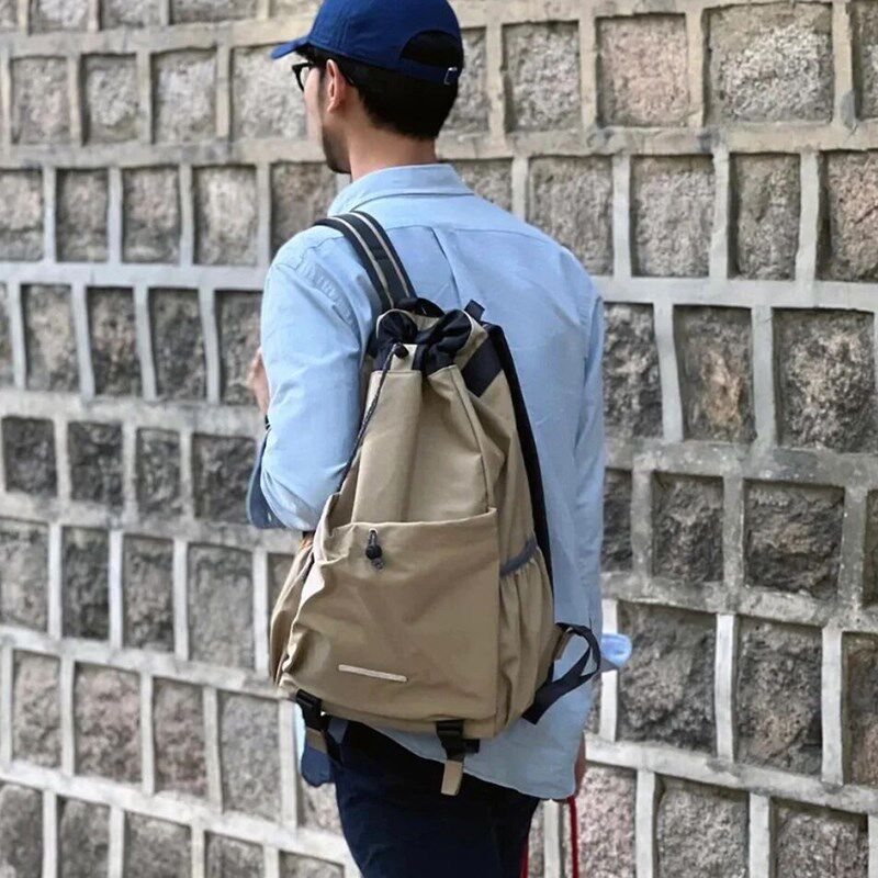 轻便抽绳双肩包男士运动户外登山背包大学生书包骑行健身帆布包女