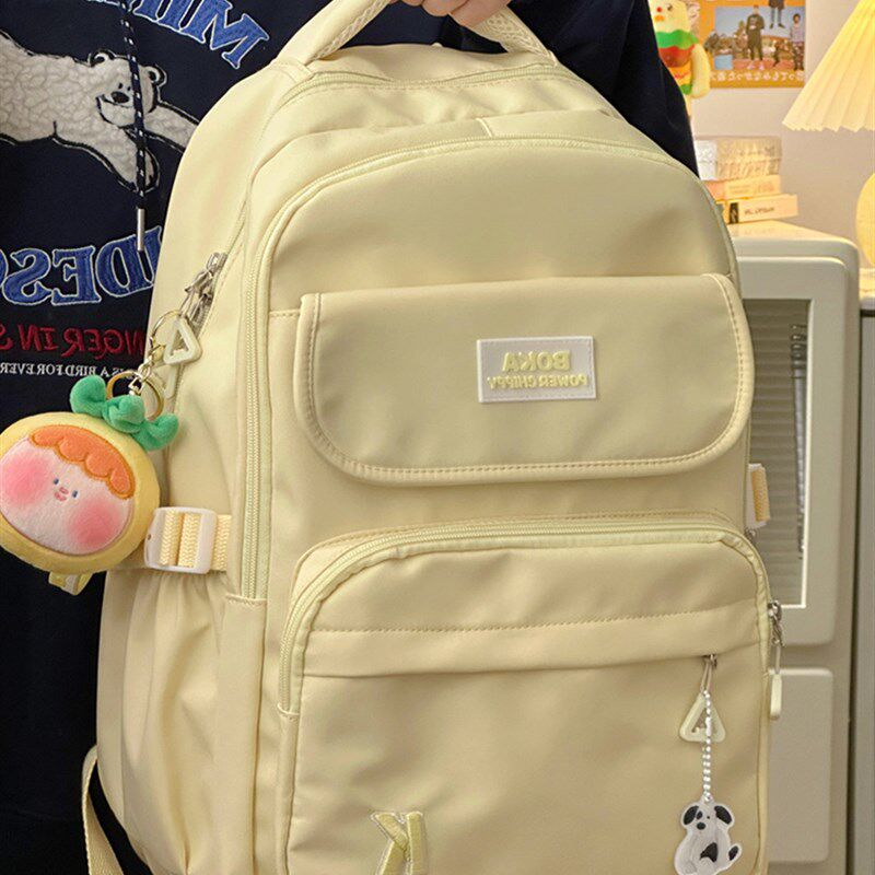 轻便双肩包女2023新款大容量黄色日系书包初中女生学院风旅行揹包