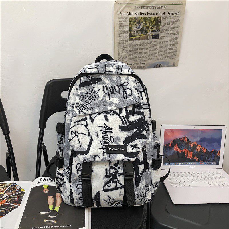 涂鸦男大学生大容量高中初中生潮流双肩包背包女ins酷防水几何