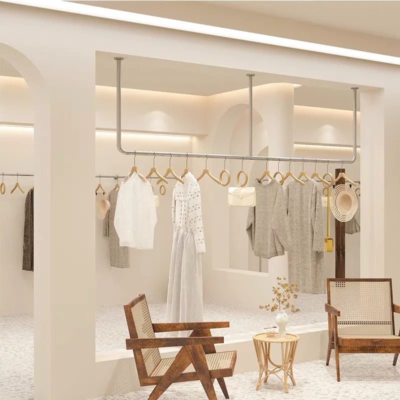 女装店不锈钢拉丝吊顶展示架图片