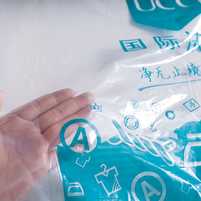 高质洗衣店收纳通用包装卷干洗店塑料防尘透明R大衣羽绒袋子罩衣