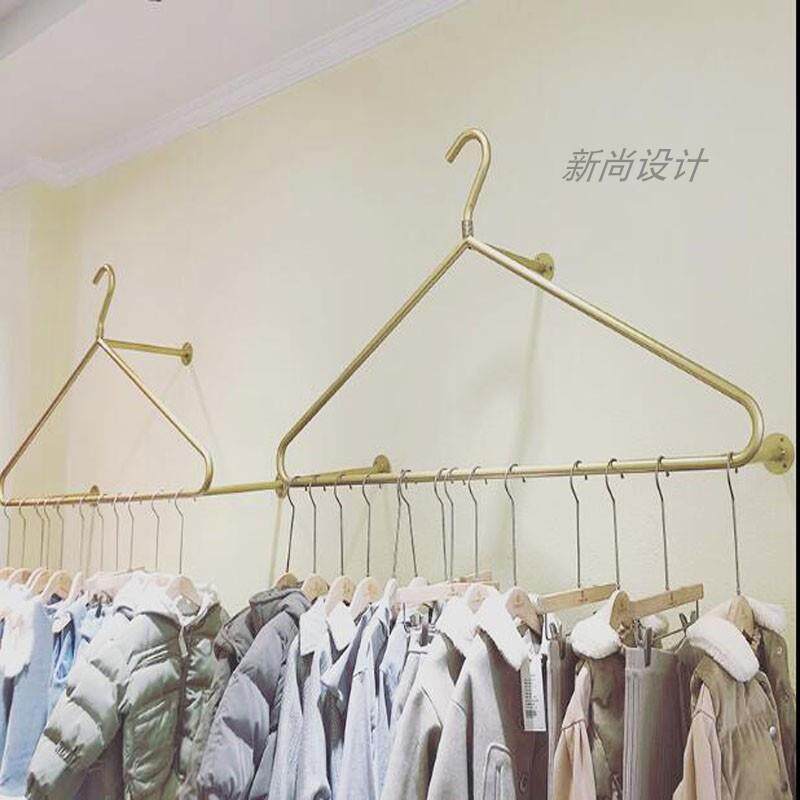 创意简约壁挂式衣架展示架上墙服装架侧挂金色服装架女装童装货架