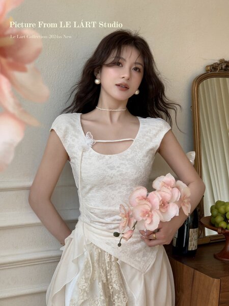 Woman wearing a white lace dress with floral details