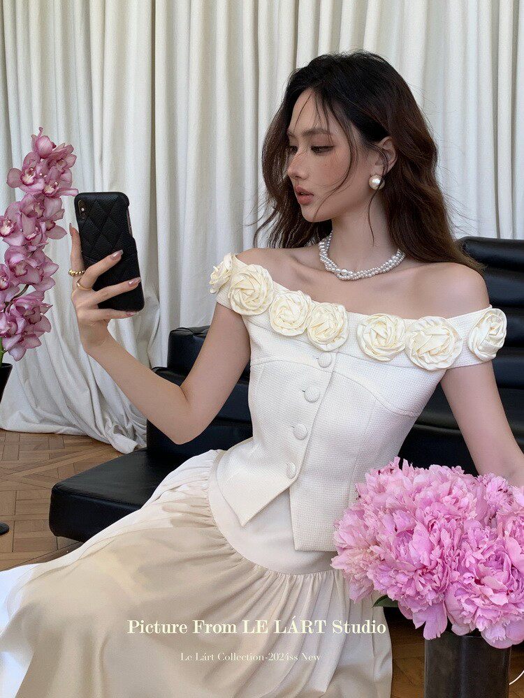 Woman wearing an off-shoulder white floral dress
