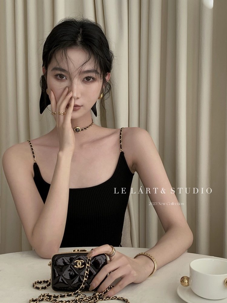 Black spaghetti-strap ribbed dress/top worn by a model