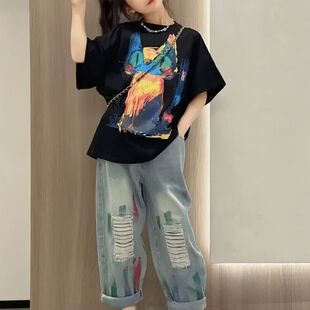 女童夏装薄款纯棉短袖T恤上衣2026新款中大童宽松卡通印花圆领服