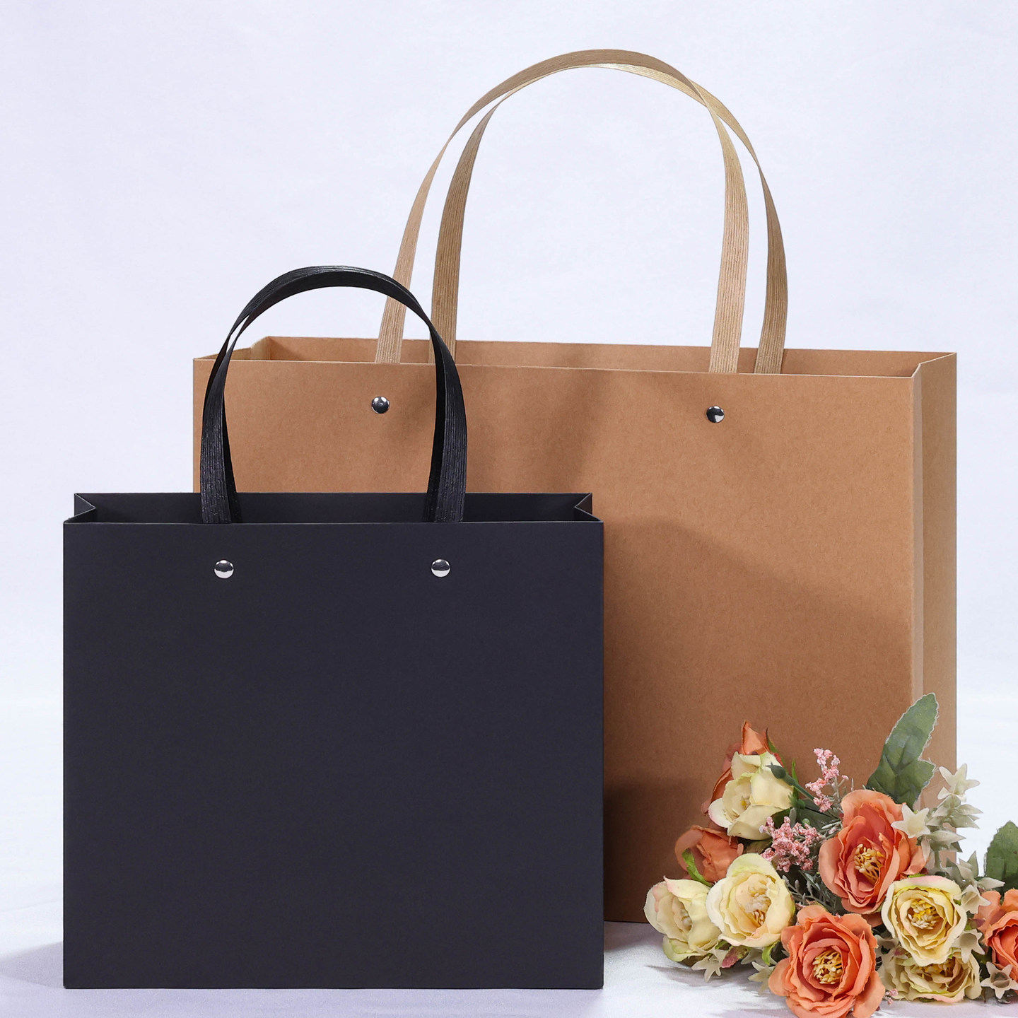 高档宽底牛皮纸袋大号红色礼品袋铆钉款服装手提袋横版购物袋定做