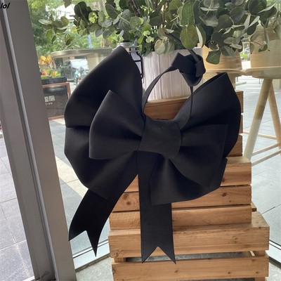 ins活动布置黑色大蝴蝶结装饰