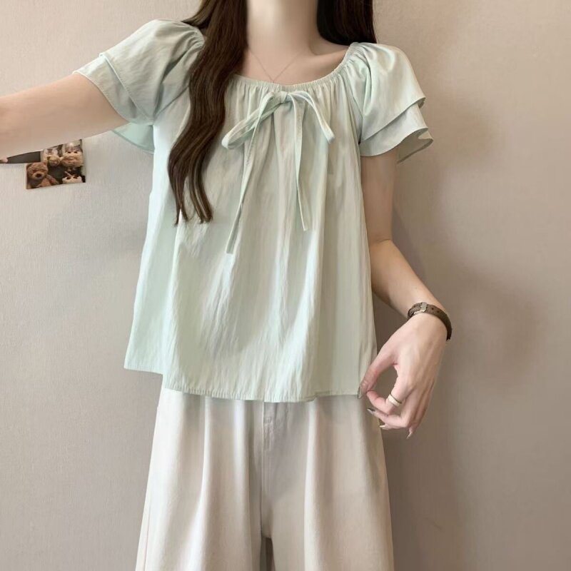 夏季女生衬衫新款圆领单排扣泡泡袖宽松蕾丝拼接简约百搭气质衬衣