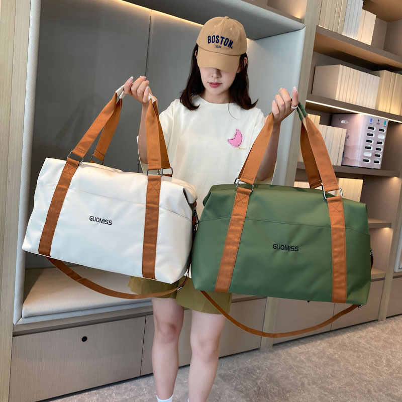 大容量旅行包斜跨短途出差行李包女简约轻便防水衣物收纳包待产包