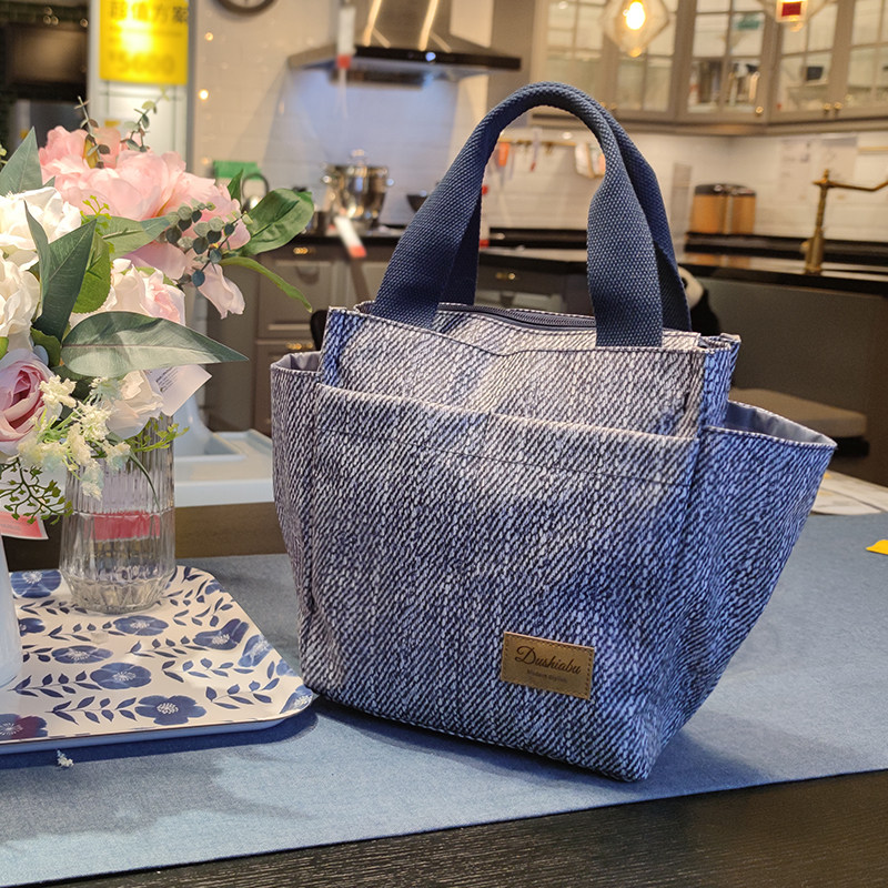 小学生饭盒手提袋防水帆布便当包小众上班族带饭拎包新款餐盒包男