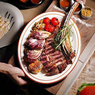 美国Tuxton耐高温西餐盘烤箱加热盘子熟成牛排盘红边线条椭圆平盘