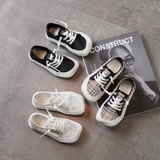 Детские ретро -холст -обувь 2021 Летняя новая голова для мальчика и одна ножка повседневных туфлей для девочек -воздушных ботинков