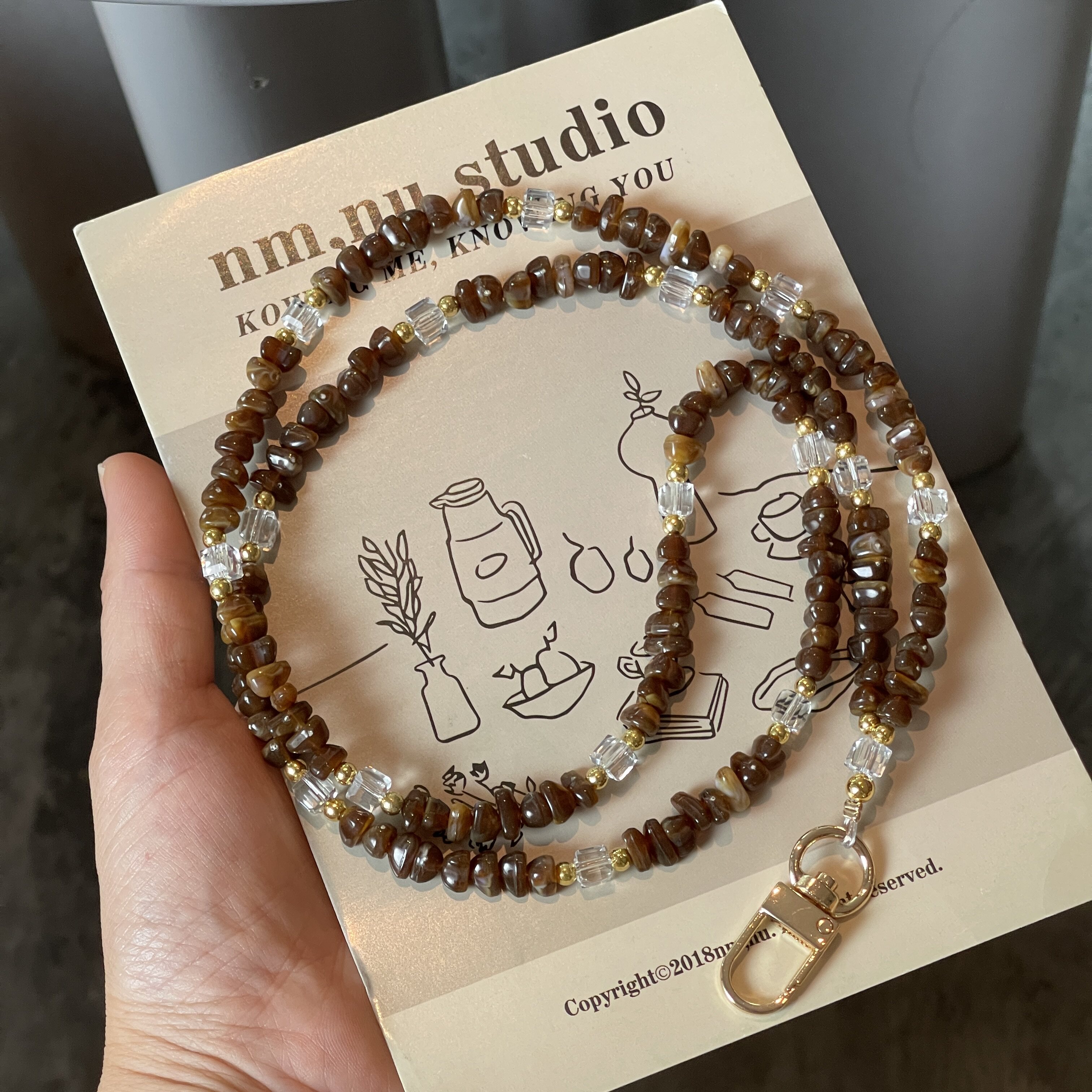 原创高级棕手机挂链条双扣挂脖防丢神奇耐用斜挎背带珠子链条小众