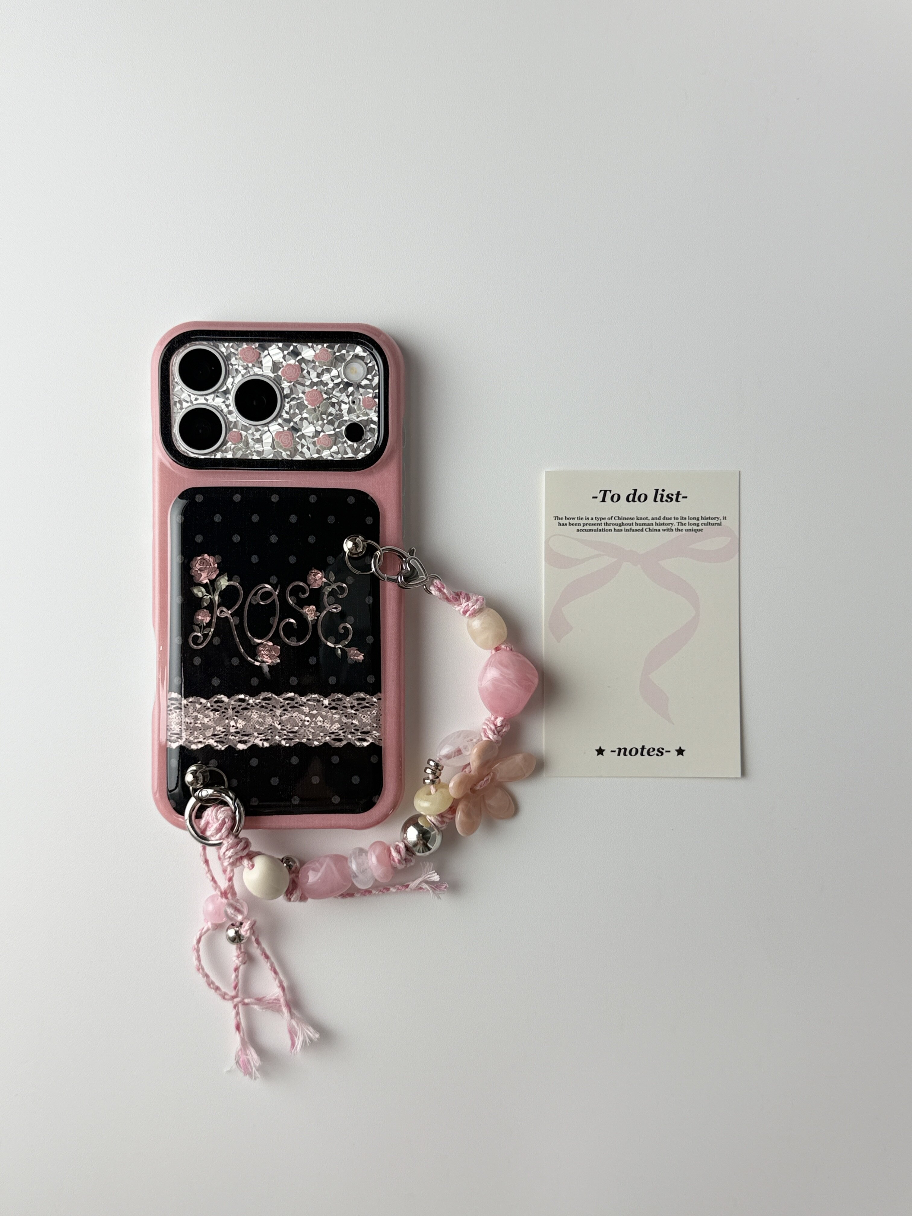 西多士ins甜酷黑波点ROSE玫瑰蕾丝壳iPhone18ProMax粉边框大视窗少女风手机壳 串珠花朵手链条