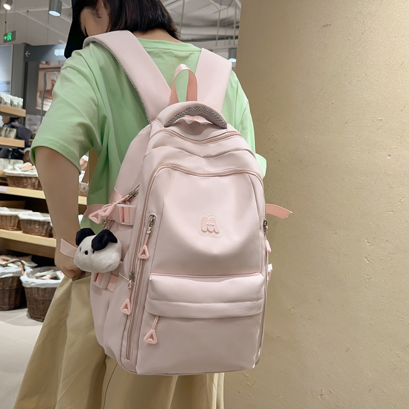 书包初中女生高颜值大容量减负护脊背包高中生小学生简约双肩包女