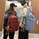 休闲双肩包新款 初高中学生书包大容量纯色尼龙挂件开学季 男女背包
