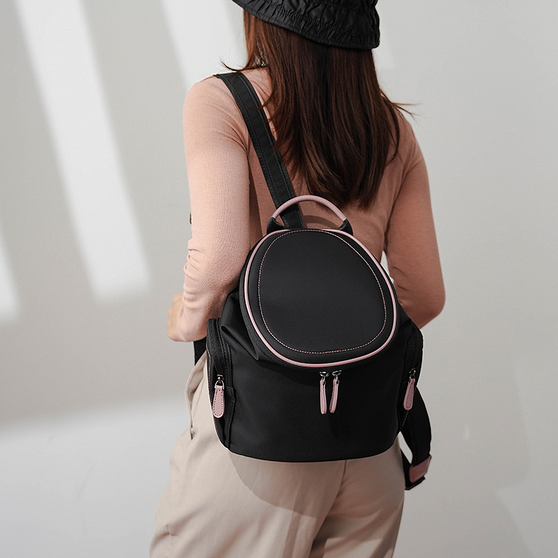 双肩包女水桶包2025新款大容量简约大学生书包牛津布旅行轻便背包