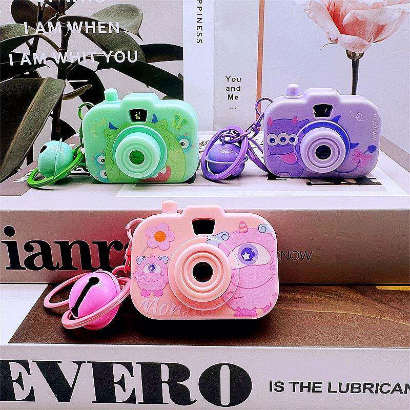 创意卡通小怪兽三眼怪迷你仿真发光投影相机钥匙扣学生玩具小礼品