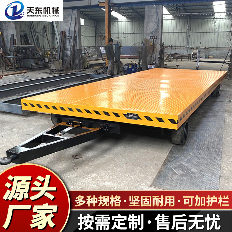 叉车牵引平板车转运托盘工具车带护栏转盘转向高载重牵引平板拖车图片