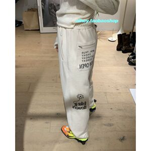 eihey诶嘿花朵字母印花抽绳松紧腰束脚宽松百搭运动休闲裤卫裤女