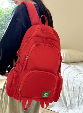 红色书包女大学生小众设计感大容量休闲旅行双肩包纯色电脑背包男