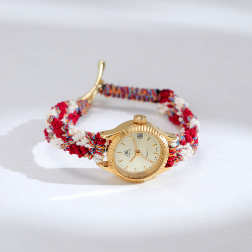 上海产90年代复古镀金狗牙圈手工编织手绳手动机械女表小巧单日历