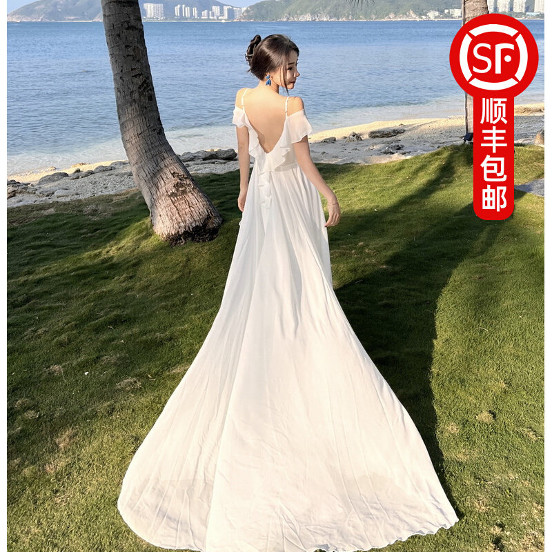 三亚旅游拍照衣服超仙海边度假白色大裙摆拖尾长裙吊带露背连衣裙