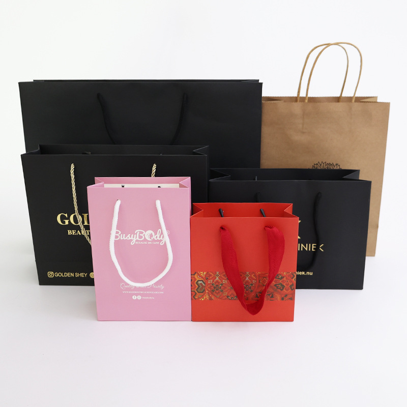 手提袋纸袋定制中国工厂高品质廉价彩色牛皮纸袋印花带把手包装袋