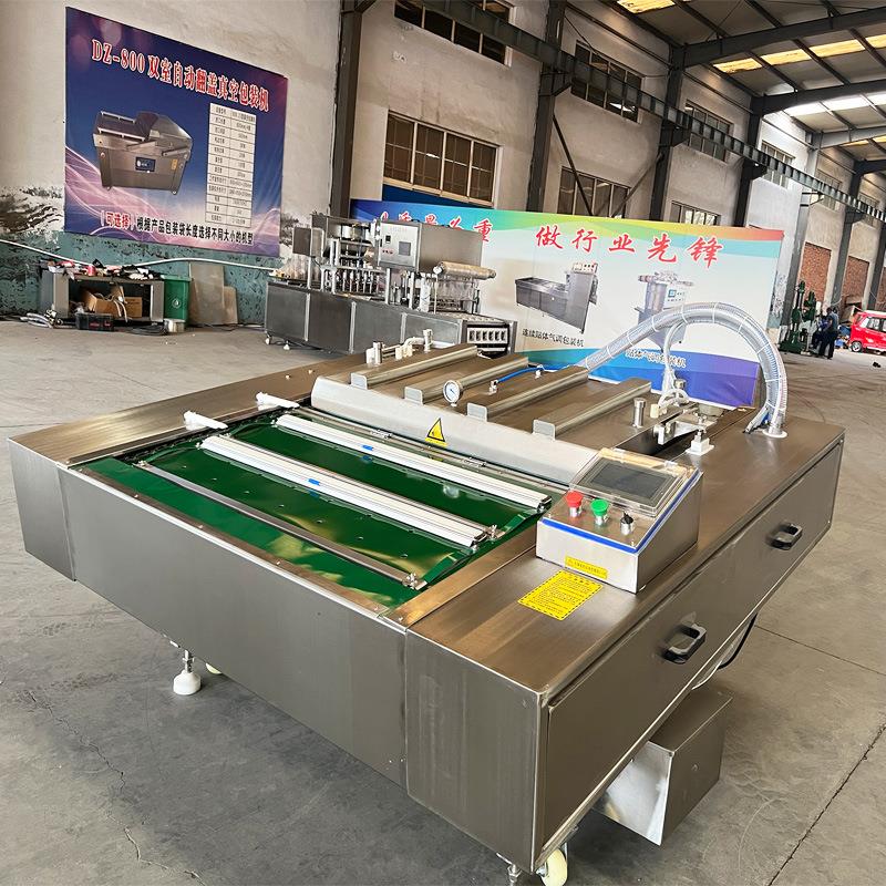 酱猪蹄滚动式真空包装机 卤味熟食可倾斜式真空封口设备1100单封