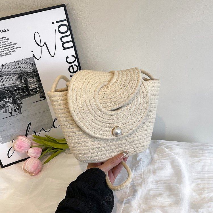 包包女2025新款珍珠休闲包斜挎小包海边度假沙滩包编织水桶包